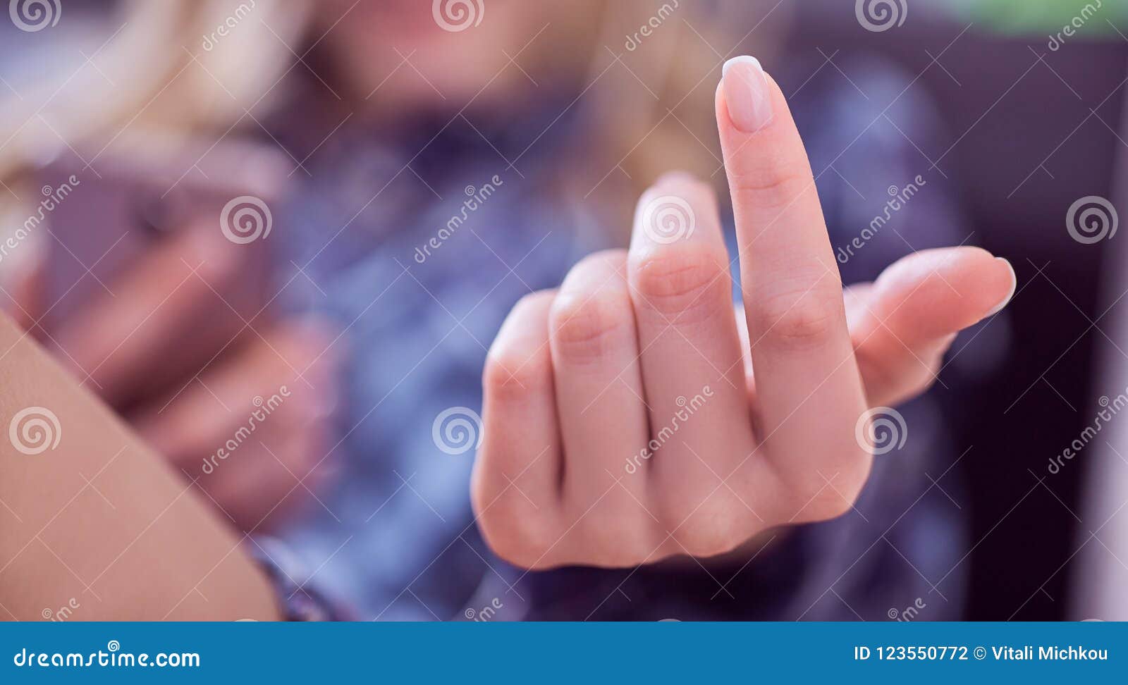 woman hand gesturing come here calling you lying on the couch and holding smartphone in hand