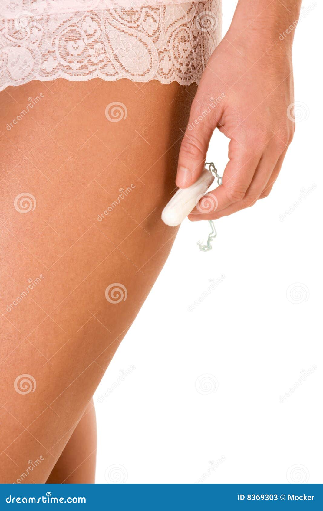 woman hand hold white cotton hygienic tampon