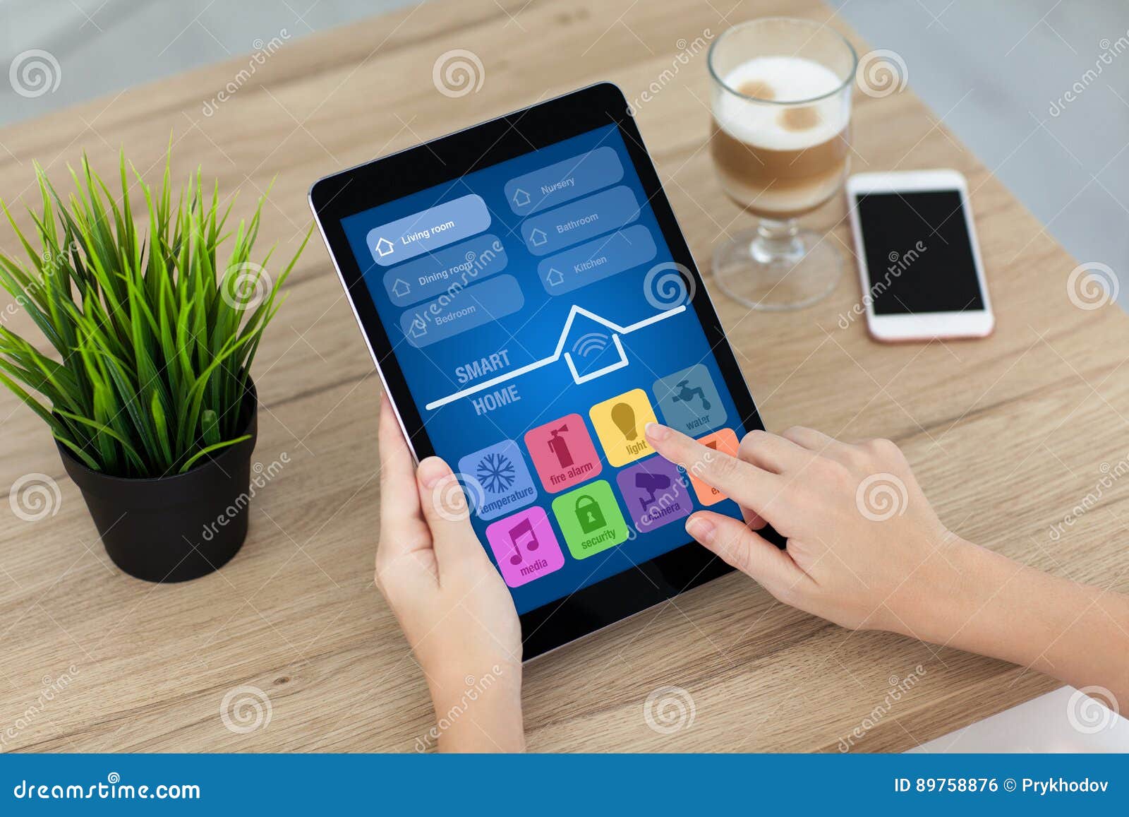 Woman Hand Holding Computer Tablet with App Smart Home Screen Stock