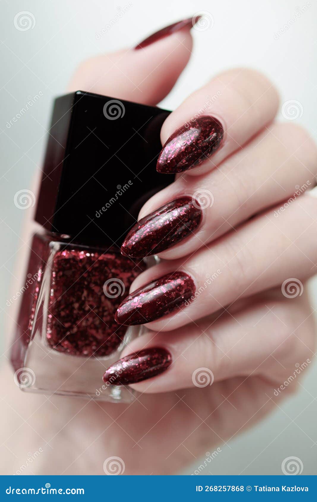 Woman Hand with Long Nails and a Bottle of Dark Red Nail Polish Stock Photo  - Image of bordot, fuchsia: 268257868