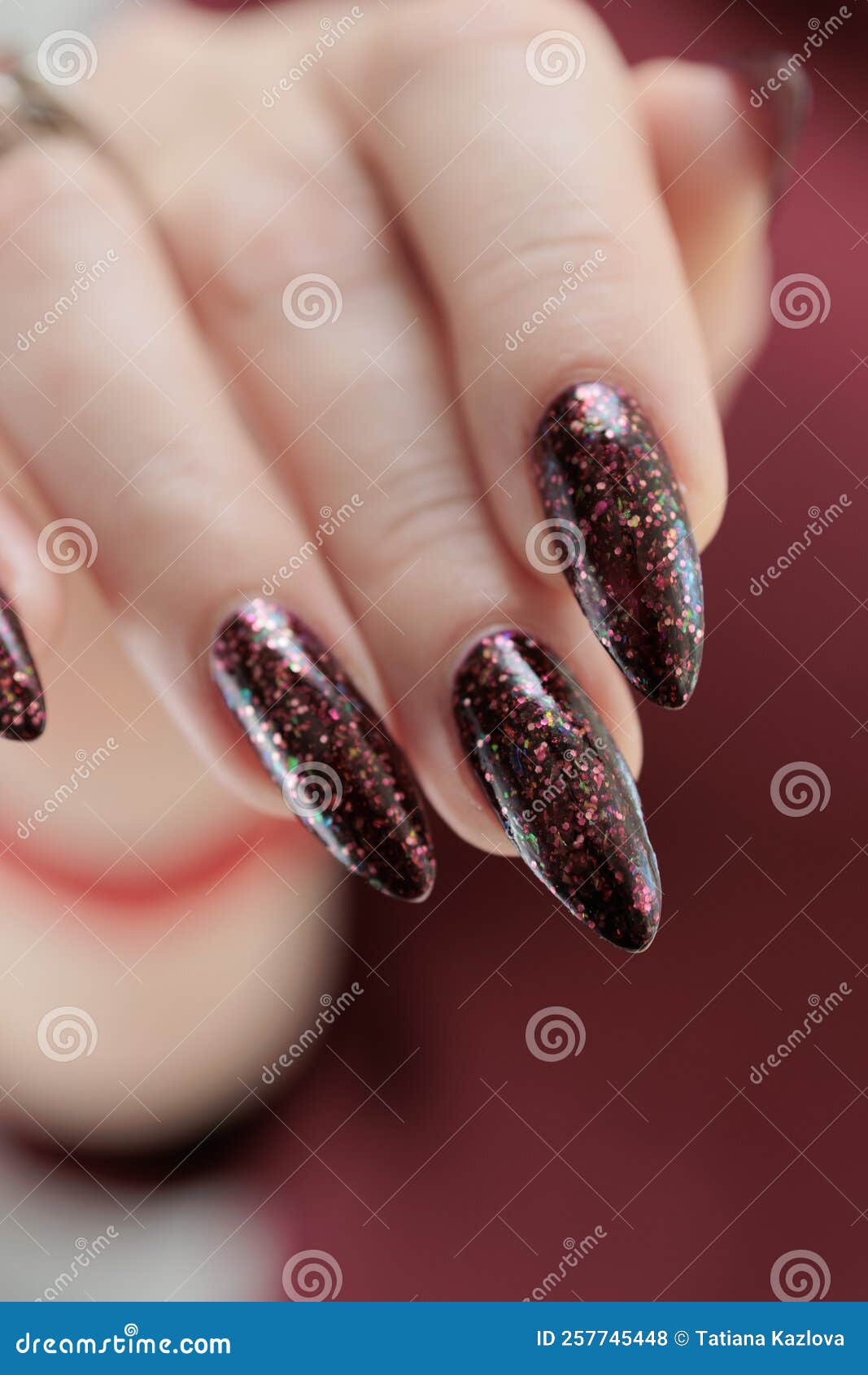 woman hand long nails dark red burgundy nail polish woman hand long nails bottle dark red burgundy nail 257745448