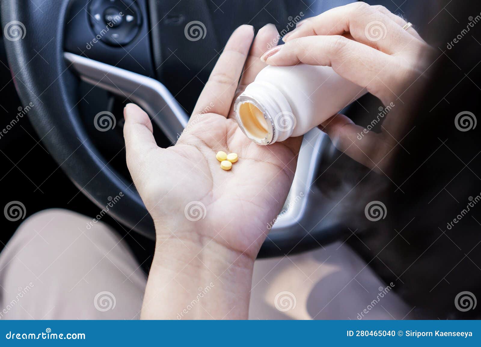 woman hand taking antihistamines or allergy medicine before driving could affect sleepiness and risk of accidents