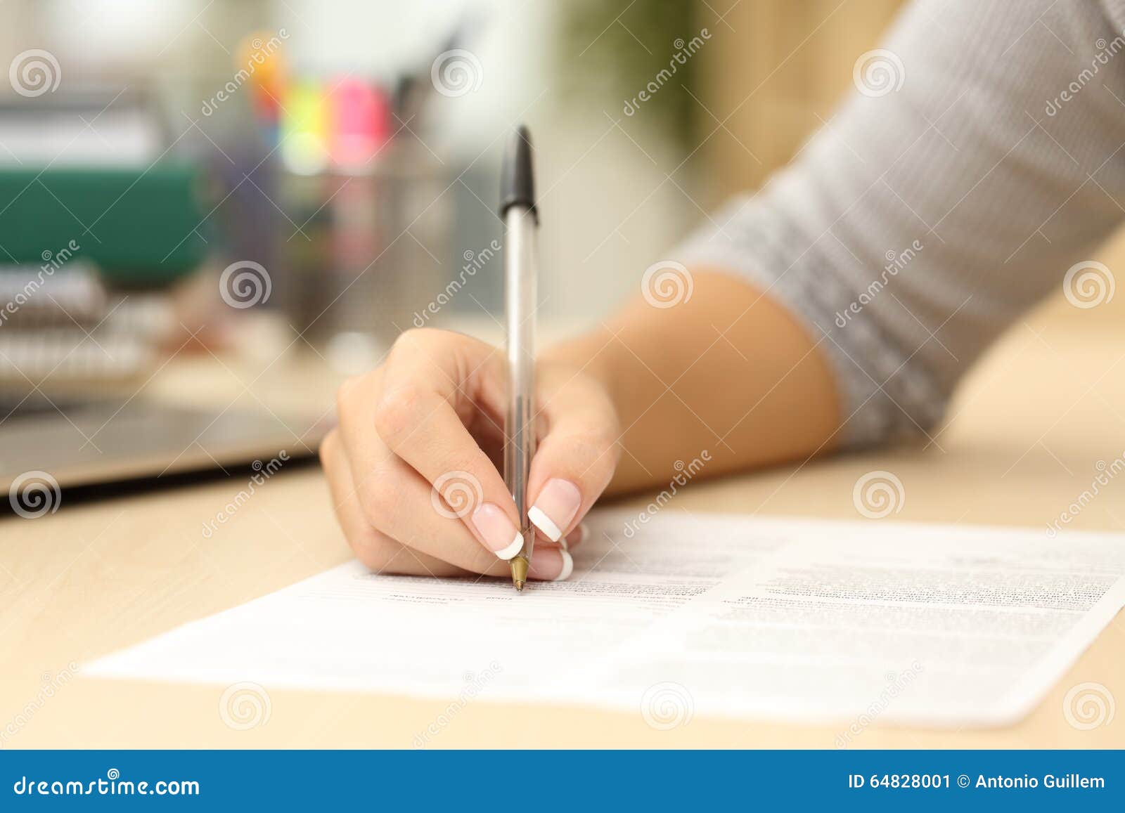 woman hand writing or signing in a document