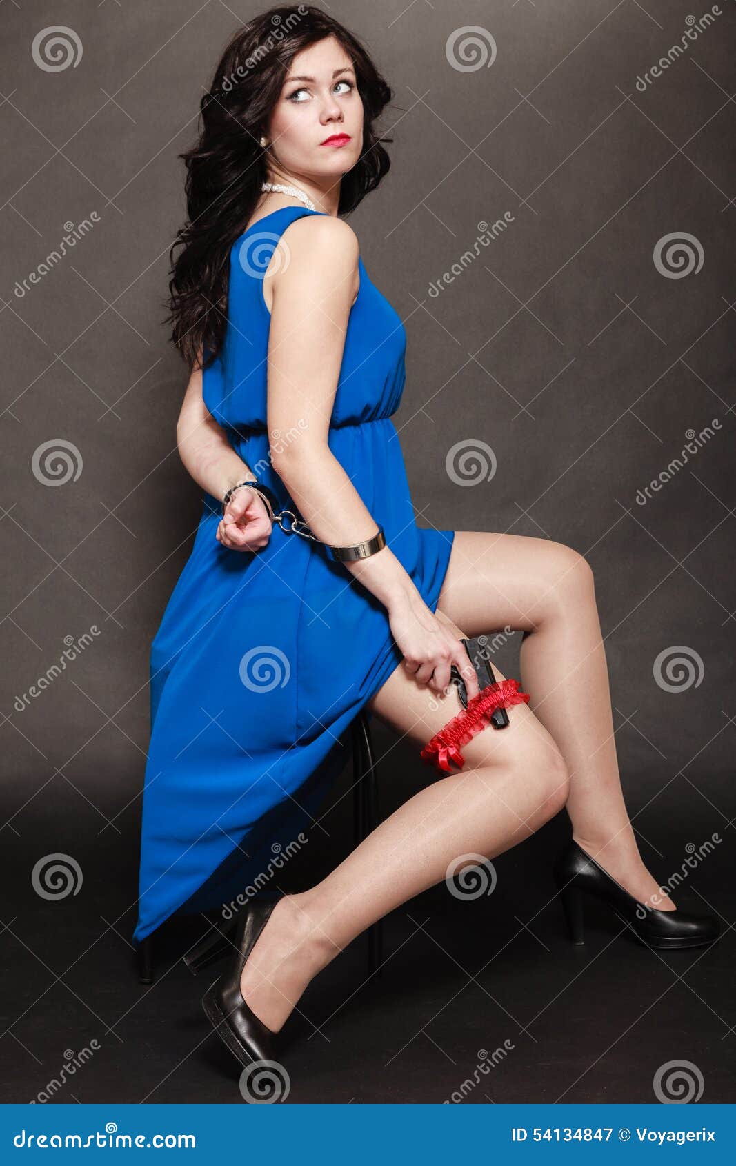 Woman in Handcuffs with Gun Stock Image picture