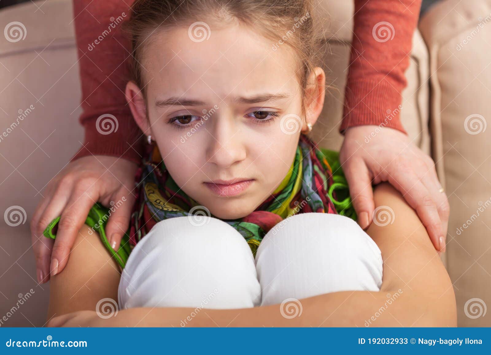 woman hands conforting troubled and sad teenager girl