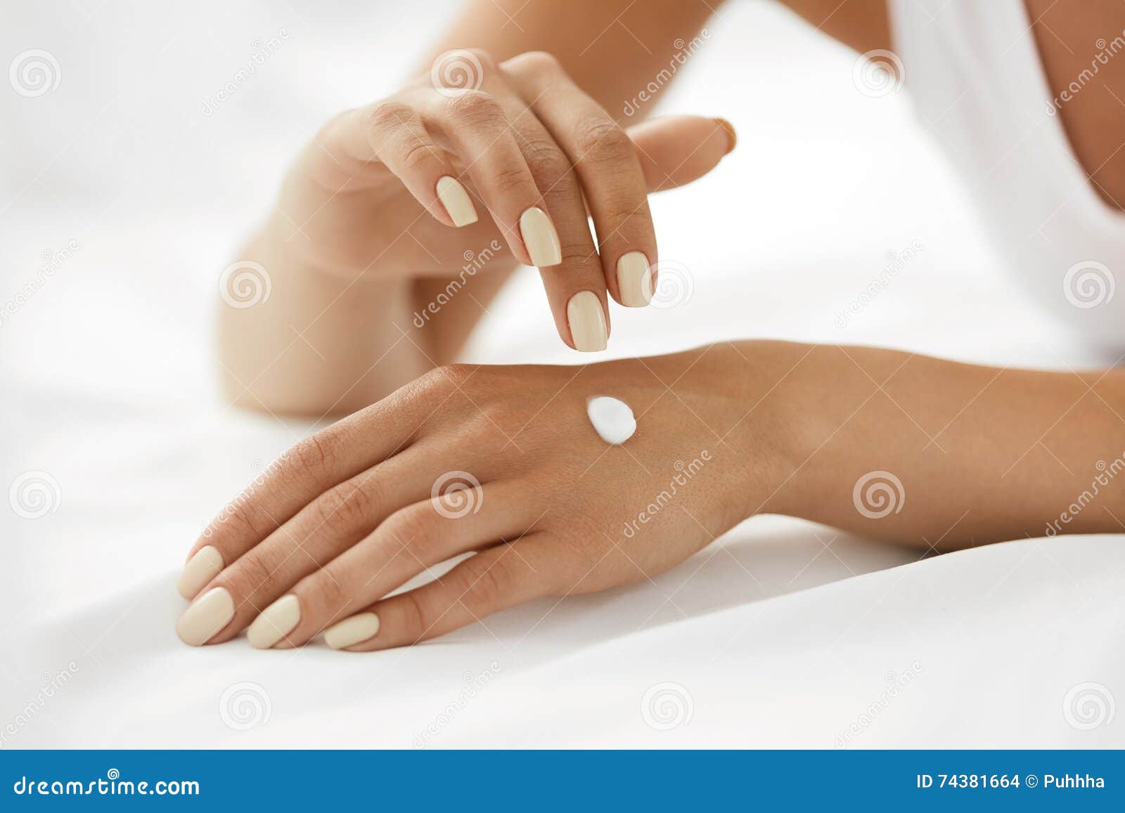 woman hands with cream. closeup of female hands applying lotion
