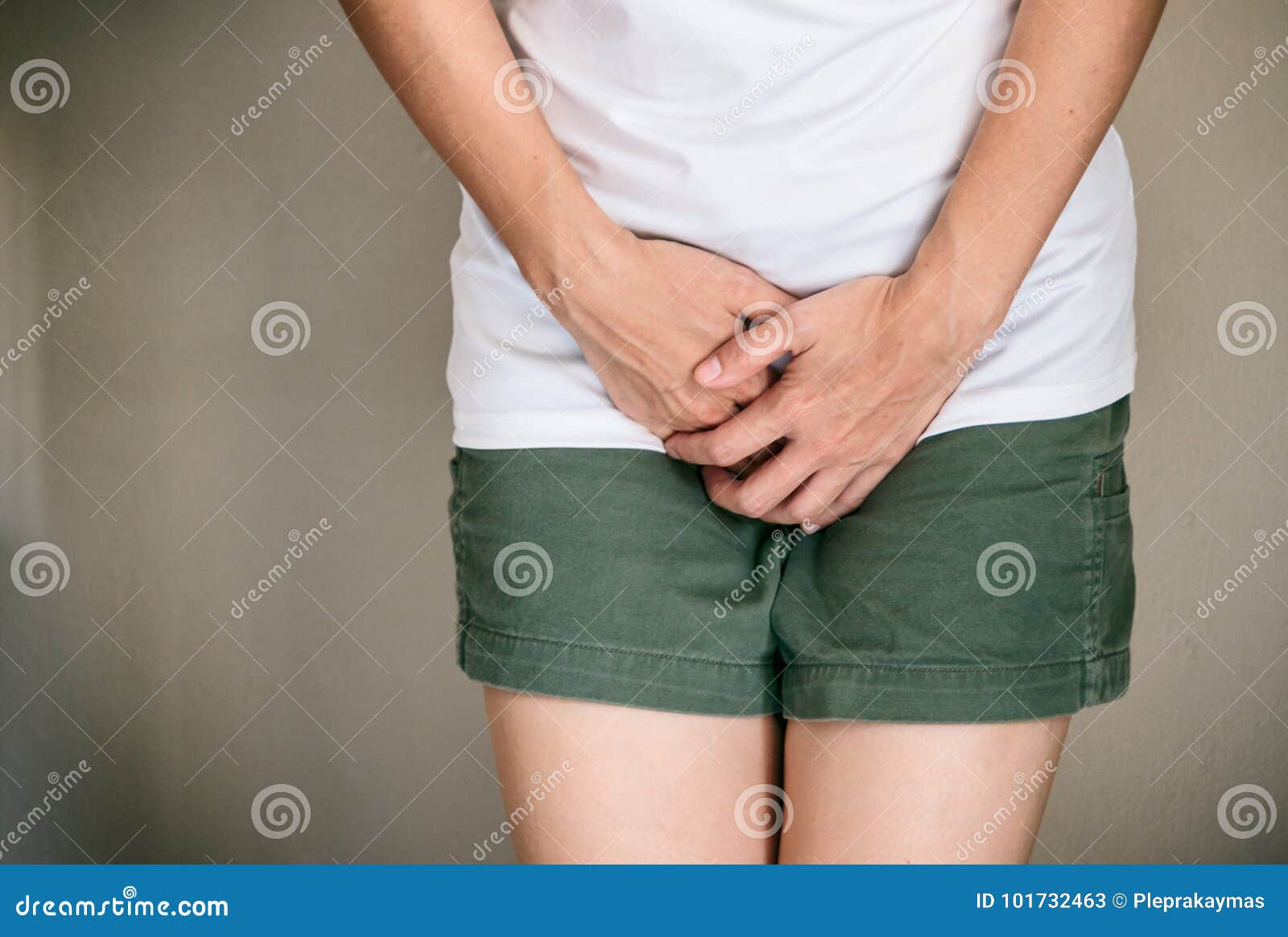 woman with hands holding her crotch she wants to pee ,urinary p