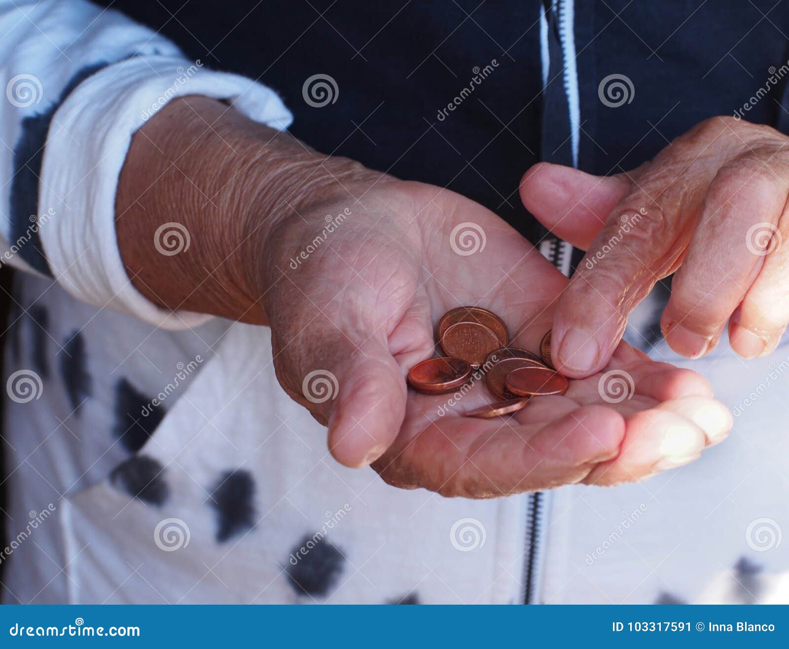 woman hands holding some euro coins. pension, poverty, social problems and senility theme