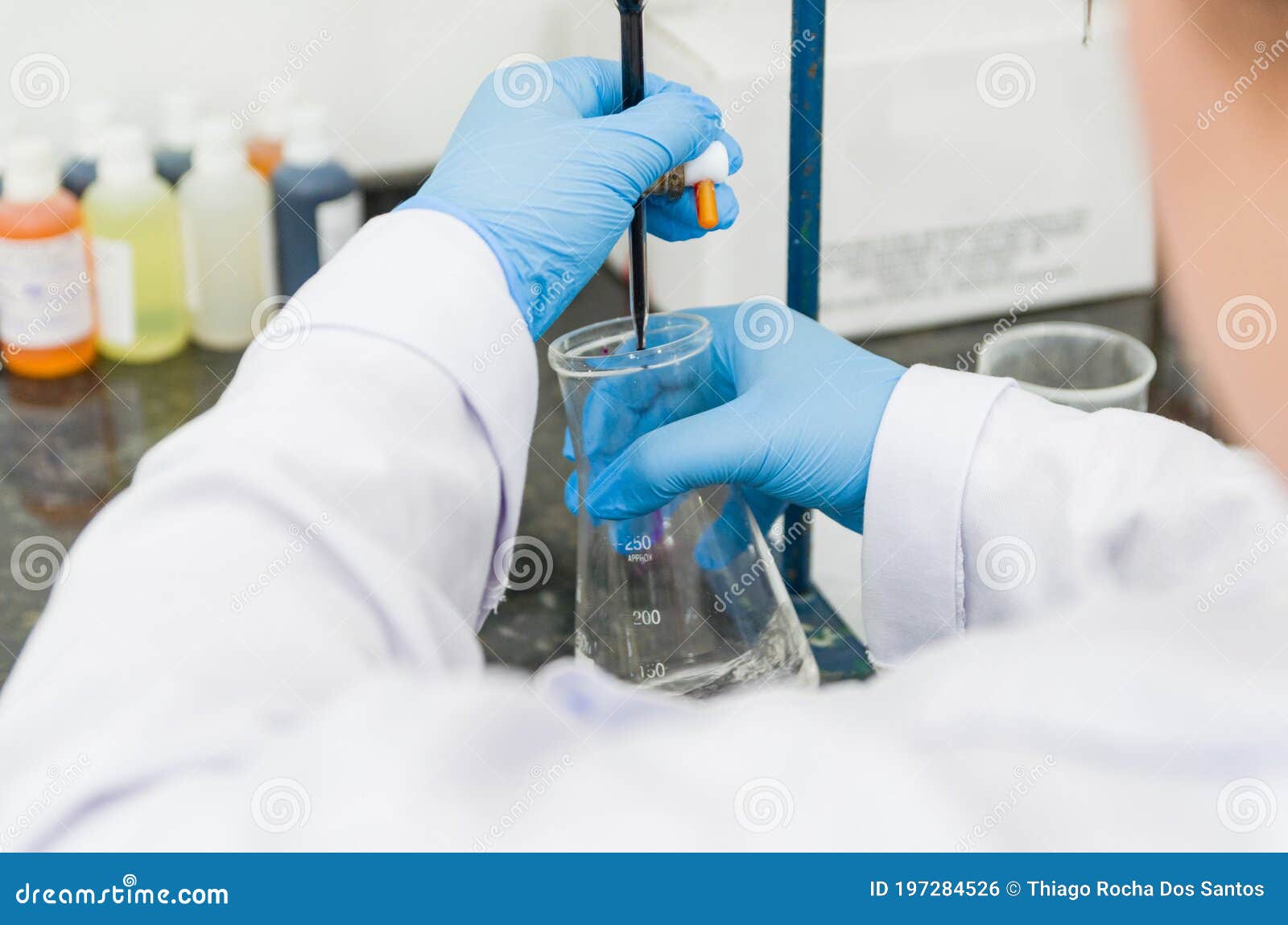 woman hands performing titration test on chemical quality contro