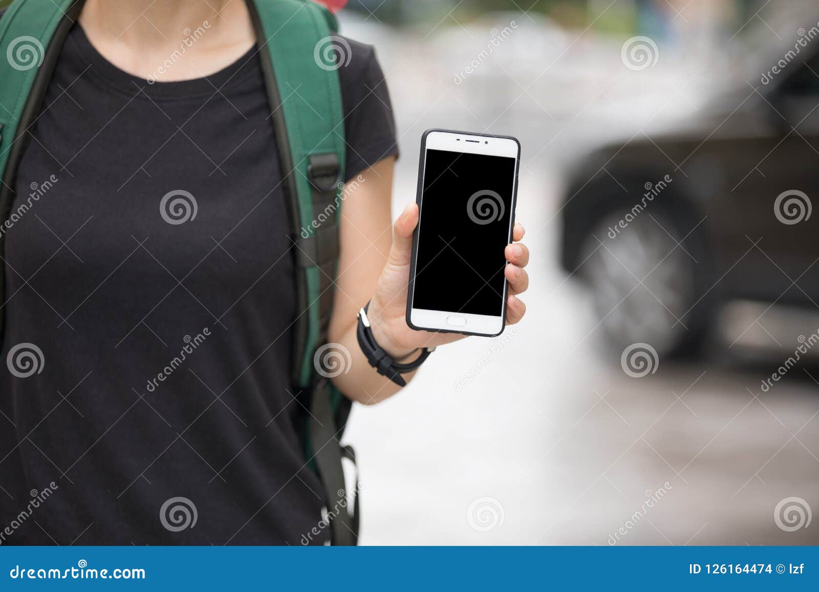 woman hands using smartphone at city