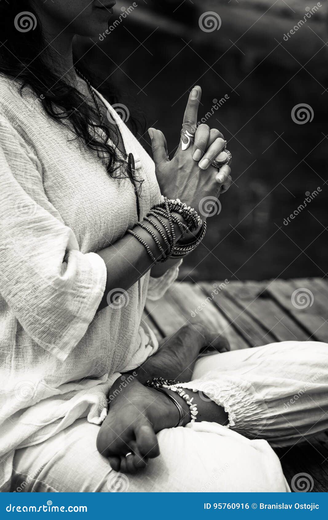 woman hands in yoga ic gesture mudra bw outdoor
