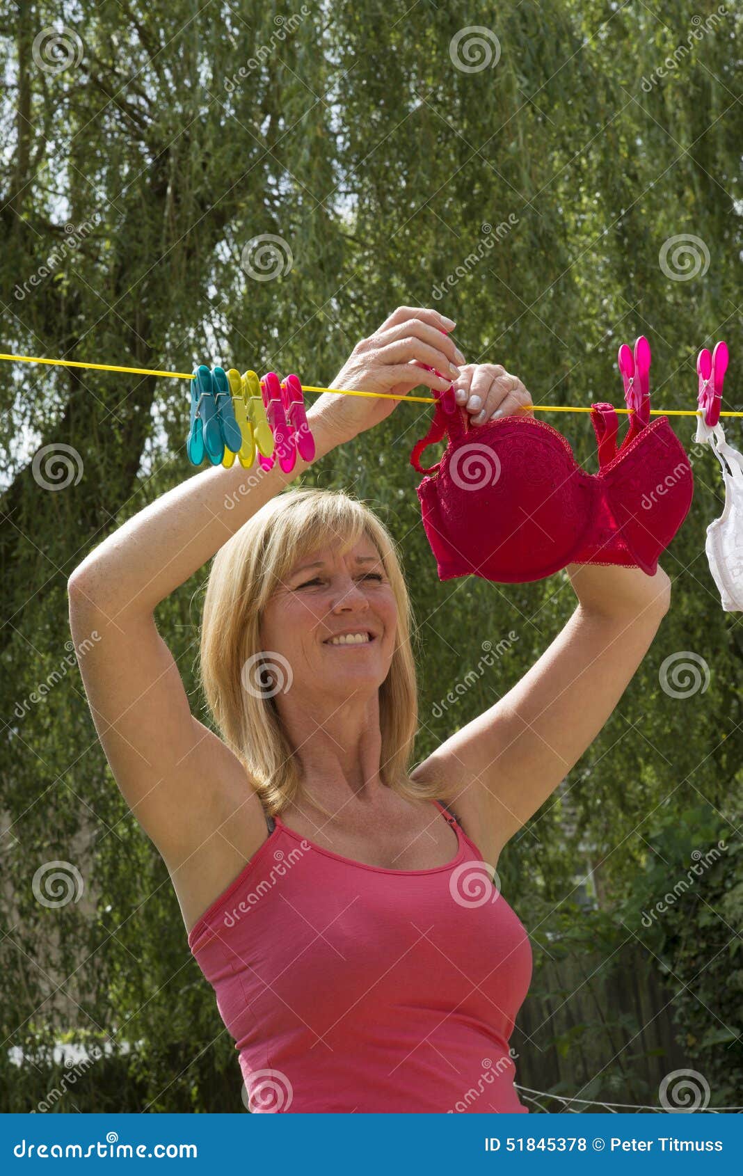 Woman Hanging Out Her Washing Stock Photo - Image of drying