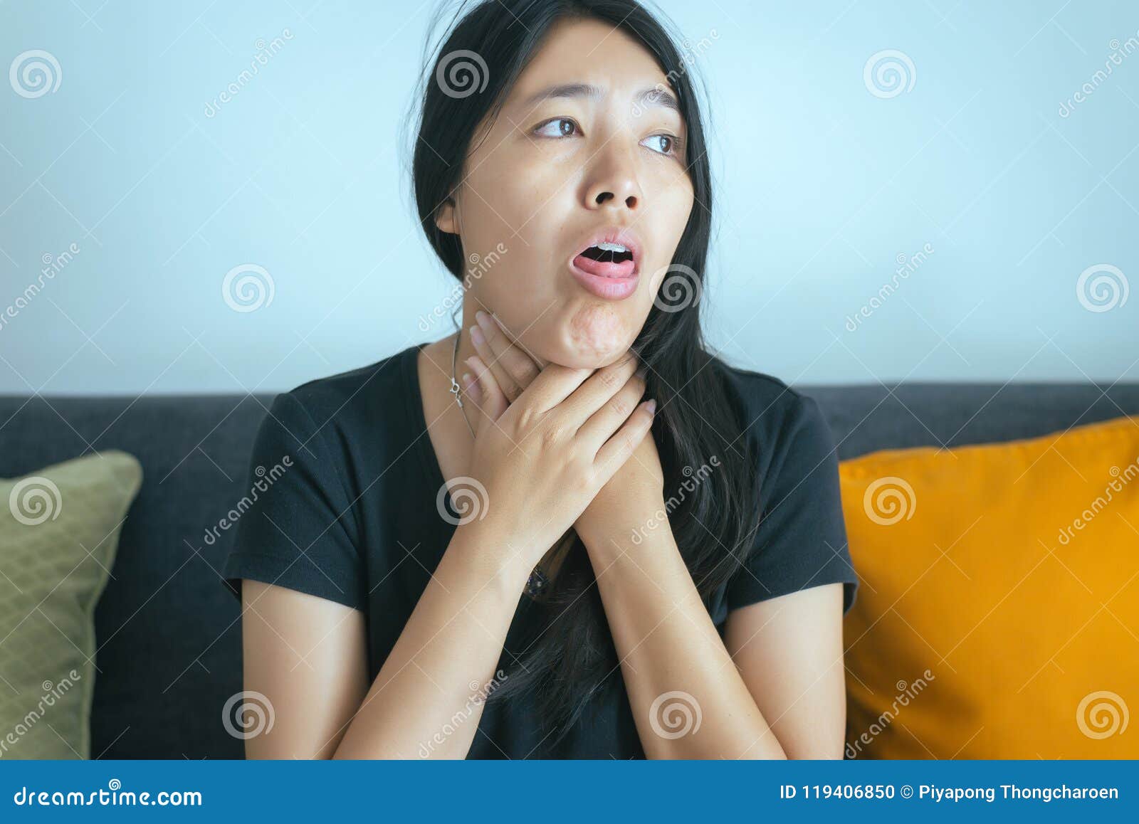 woman have a sore throat,female sick and touching her neck with hand,healthcare 