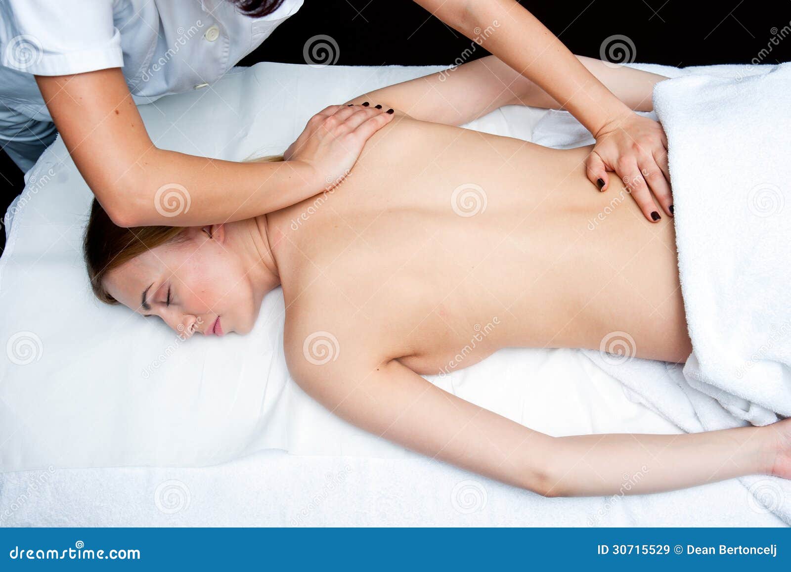 woman having chiropractic back adjustment