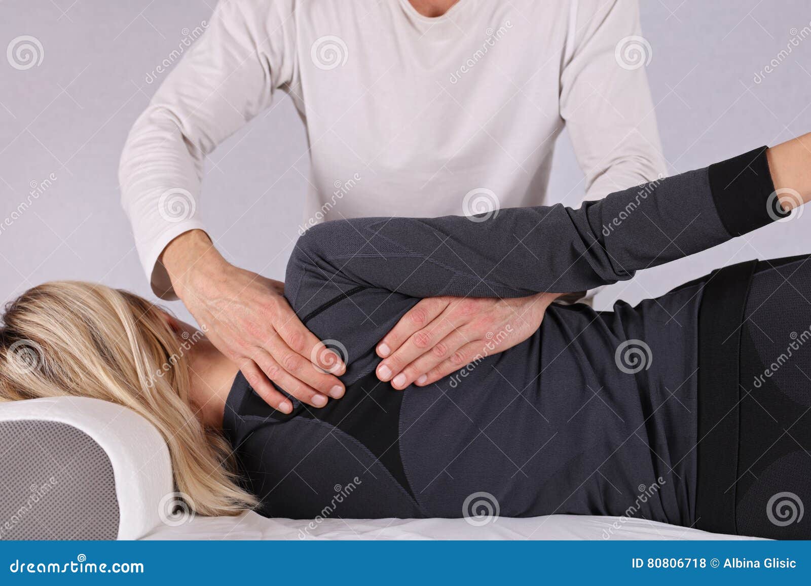 Woman having chiropractic back adjustment close up 