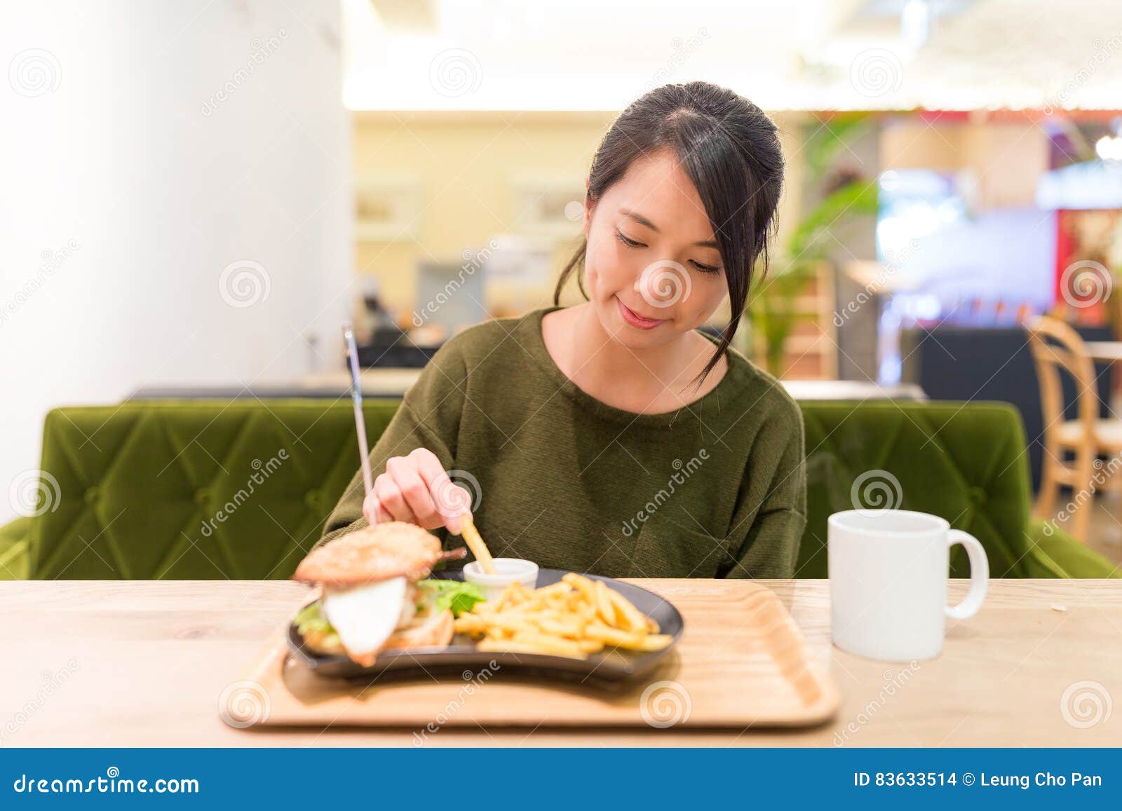 Woman Having French Fries in Restaurant Stock Photo - Image of dish