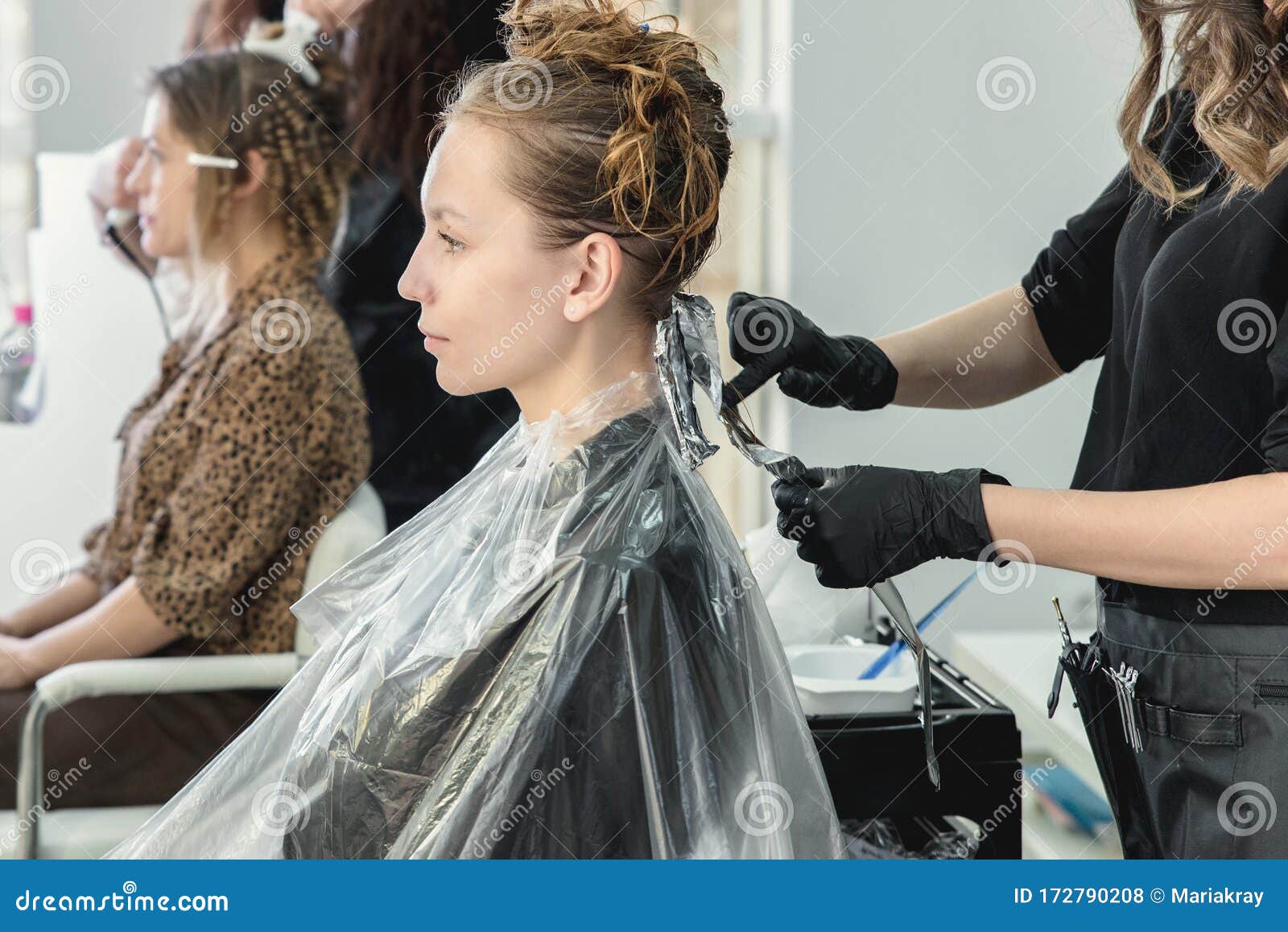 Hairdresser Coloring Young Woman Hair Using Foil Stock Photo - Image of hair,  color: 172790208