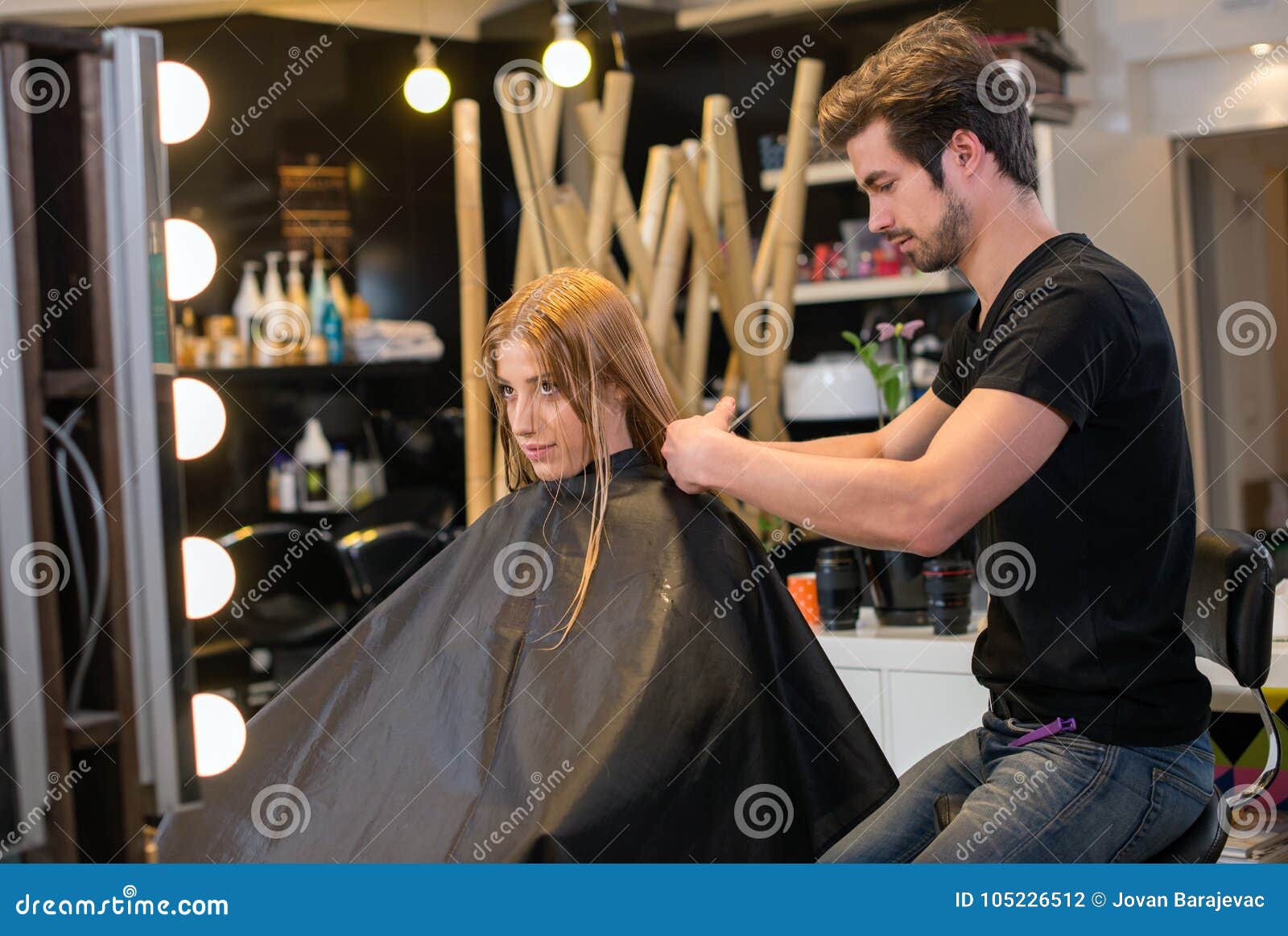 woman having hair styled in salon