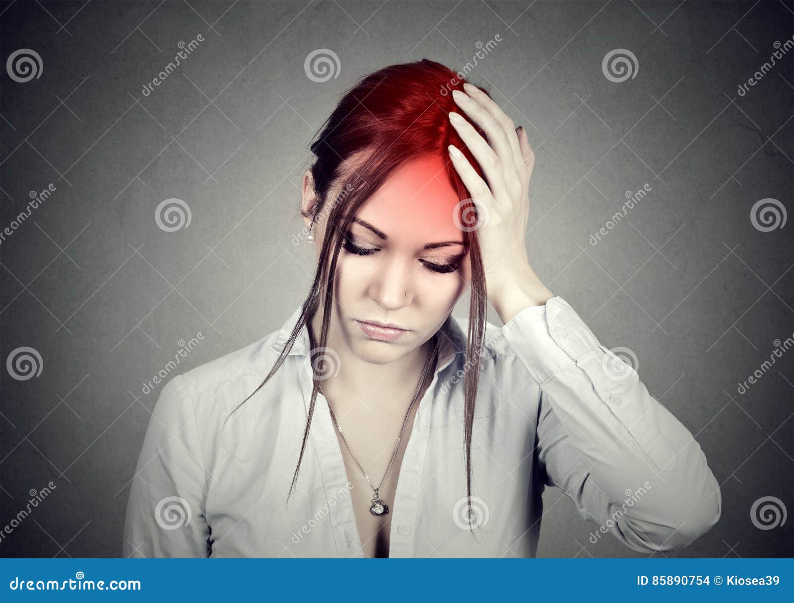 woman having a headache with her head in her hand