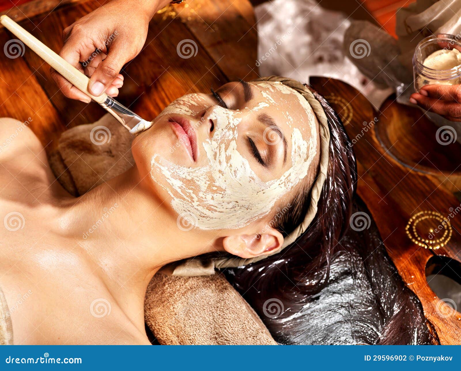 woman having mask at ayurveda spa.