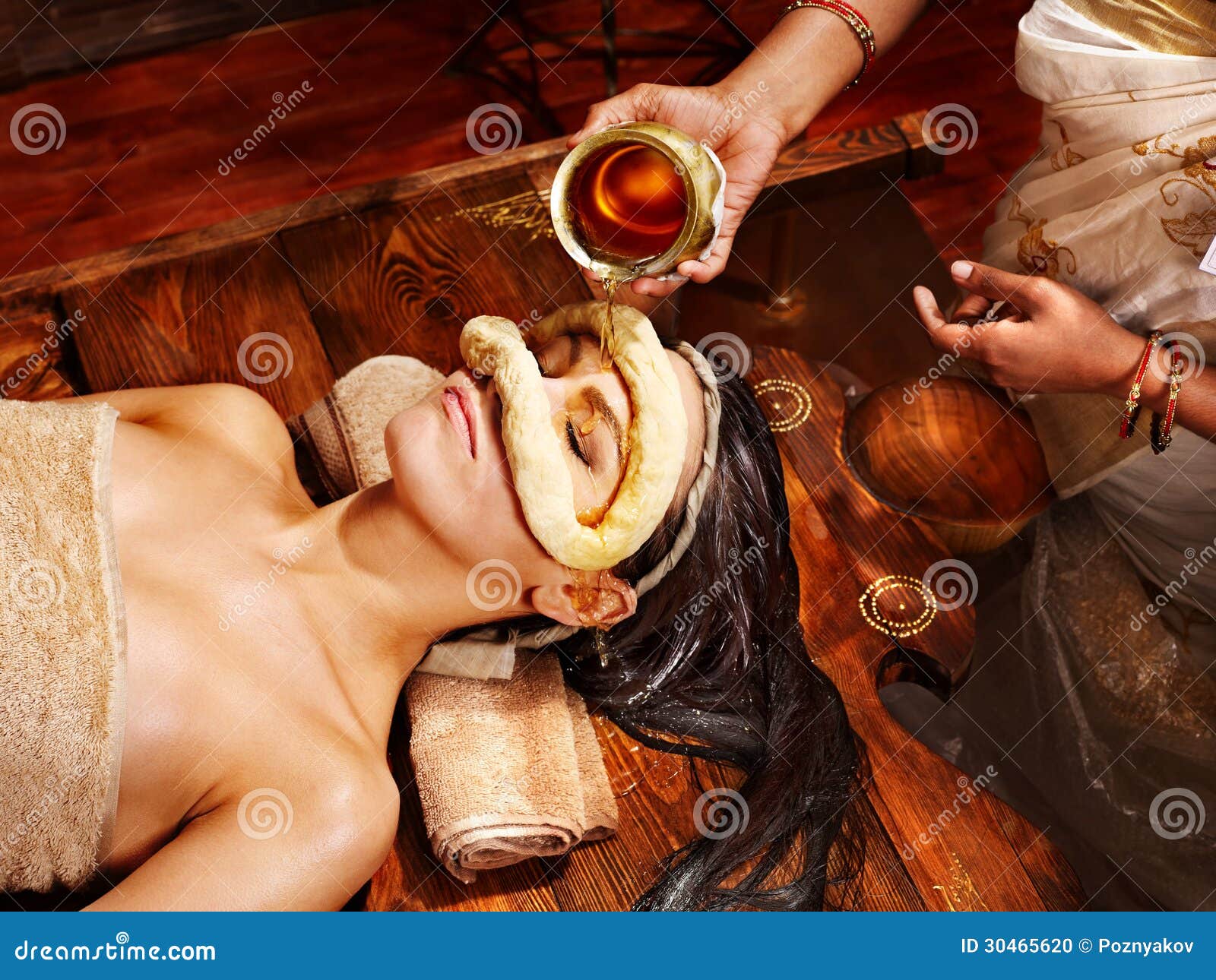 woman having mask at ayurveda spa.