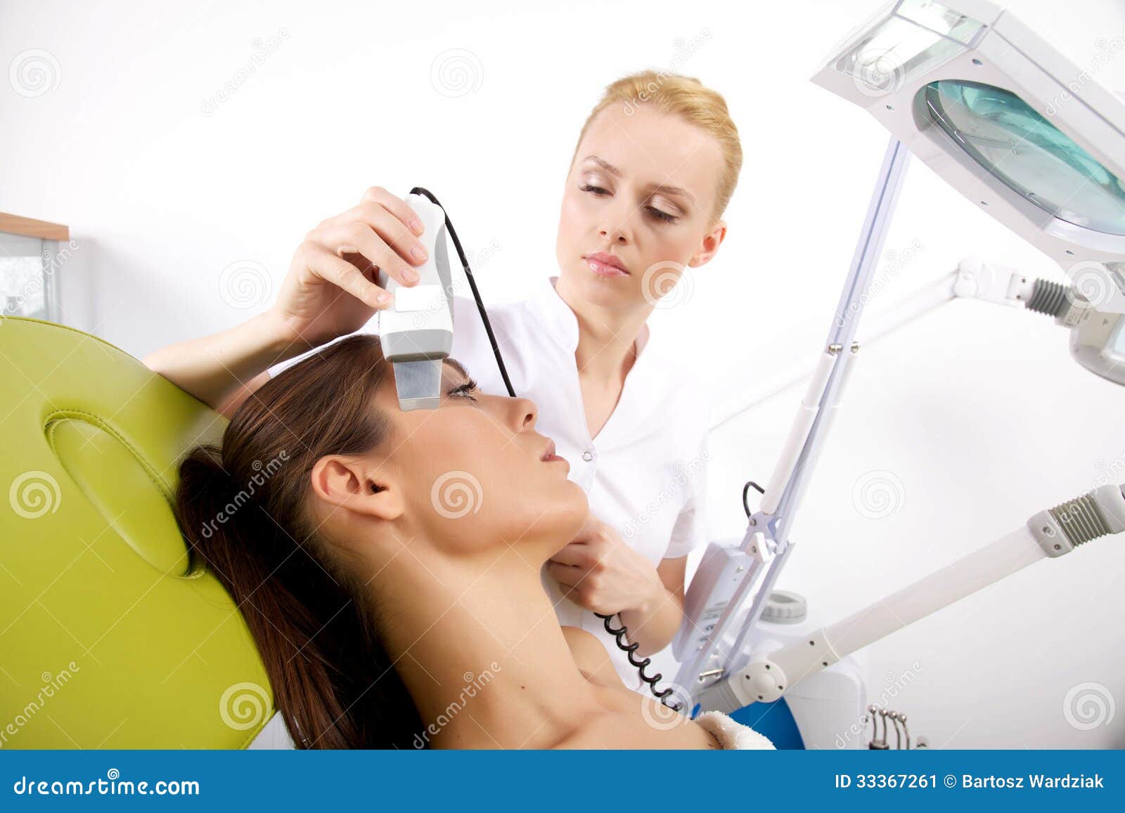 Woman Having A Stimulating Facial Treatment From A Therapist Stock