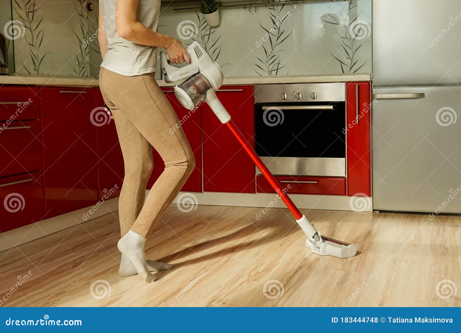 Woman Cleaning House With Wireless Vacuum Cleaner Stock Photo Image