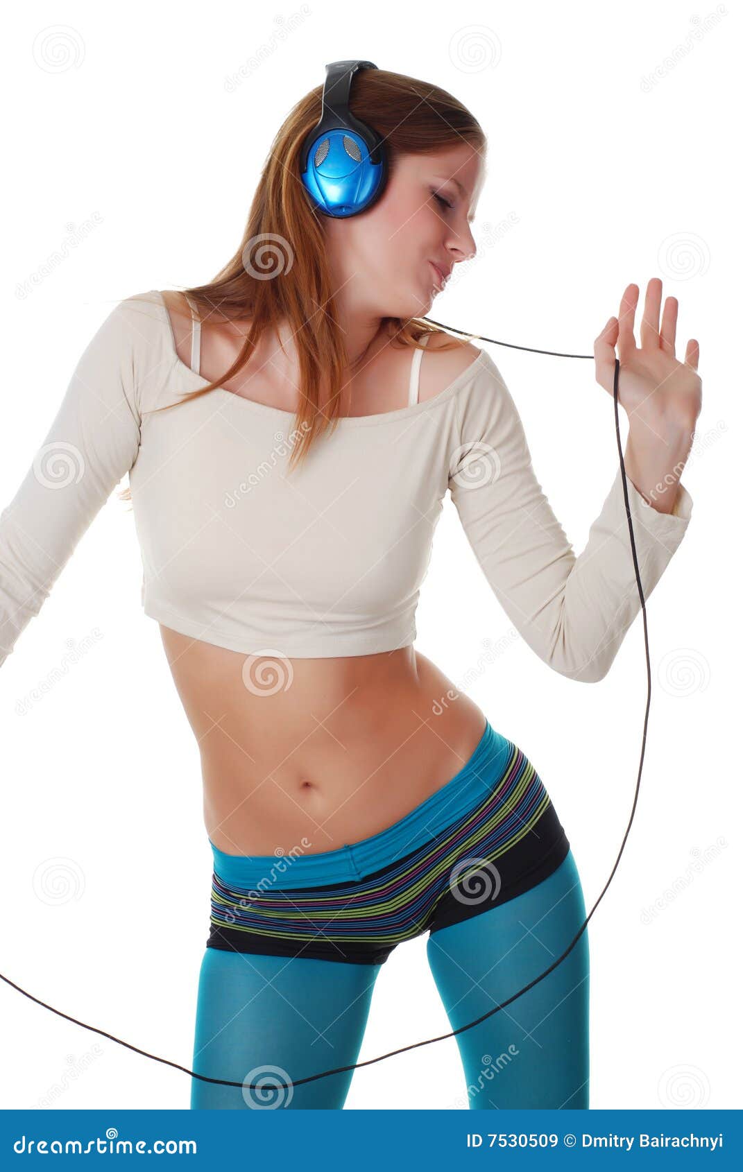 Woman with headpfones. Young beautiful woman listening music with headpfones