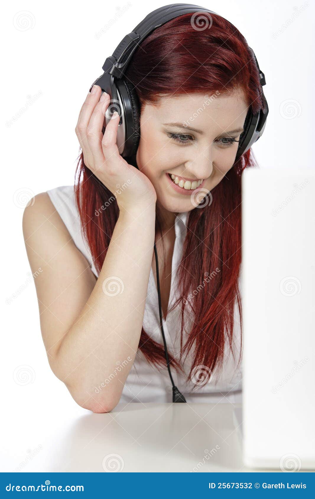 Woman with Headphones Working on Laptop Stock Photo Image of young, modern 25673532