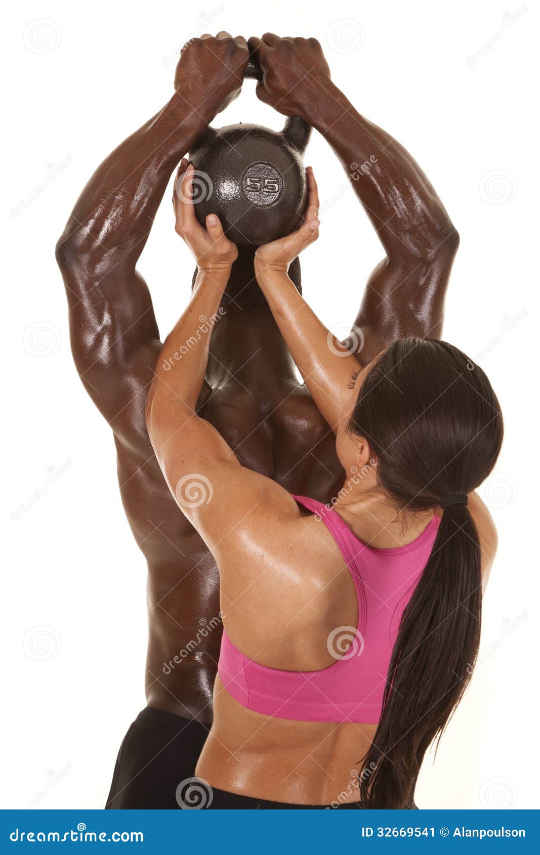 Royalty-Free photo: Photograph of woman in black sport brassiere holding  kettlebell