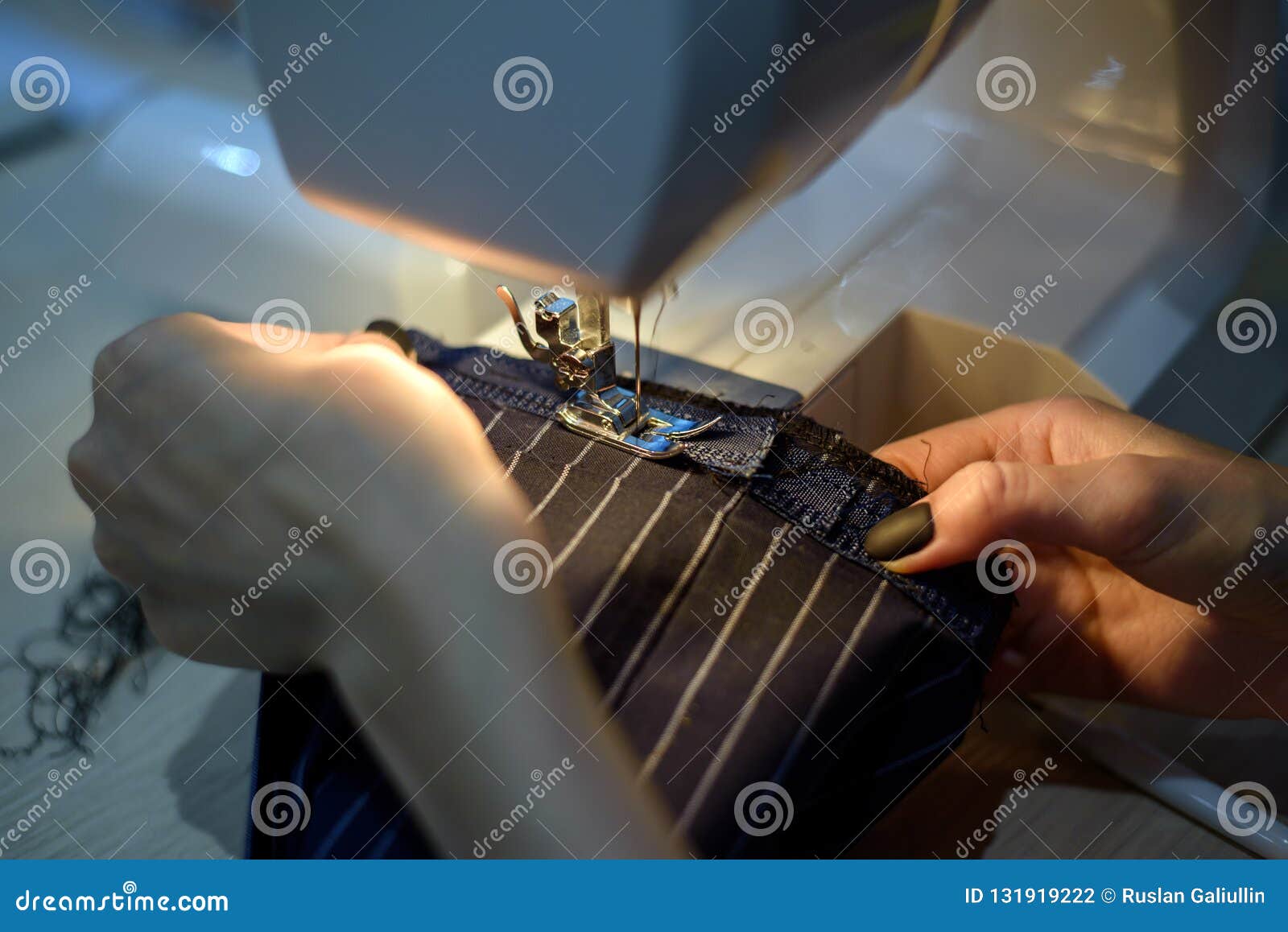 Woman Hemming Men`s Pants on the Sewing Machine Stock Photo Image of