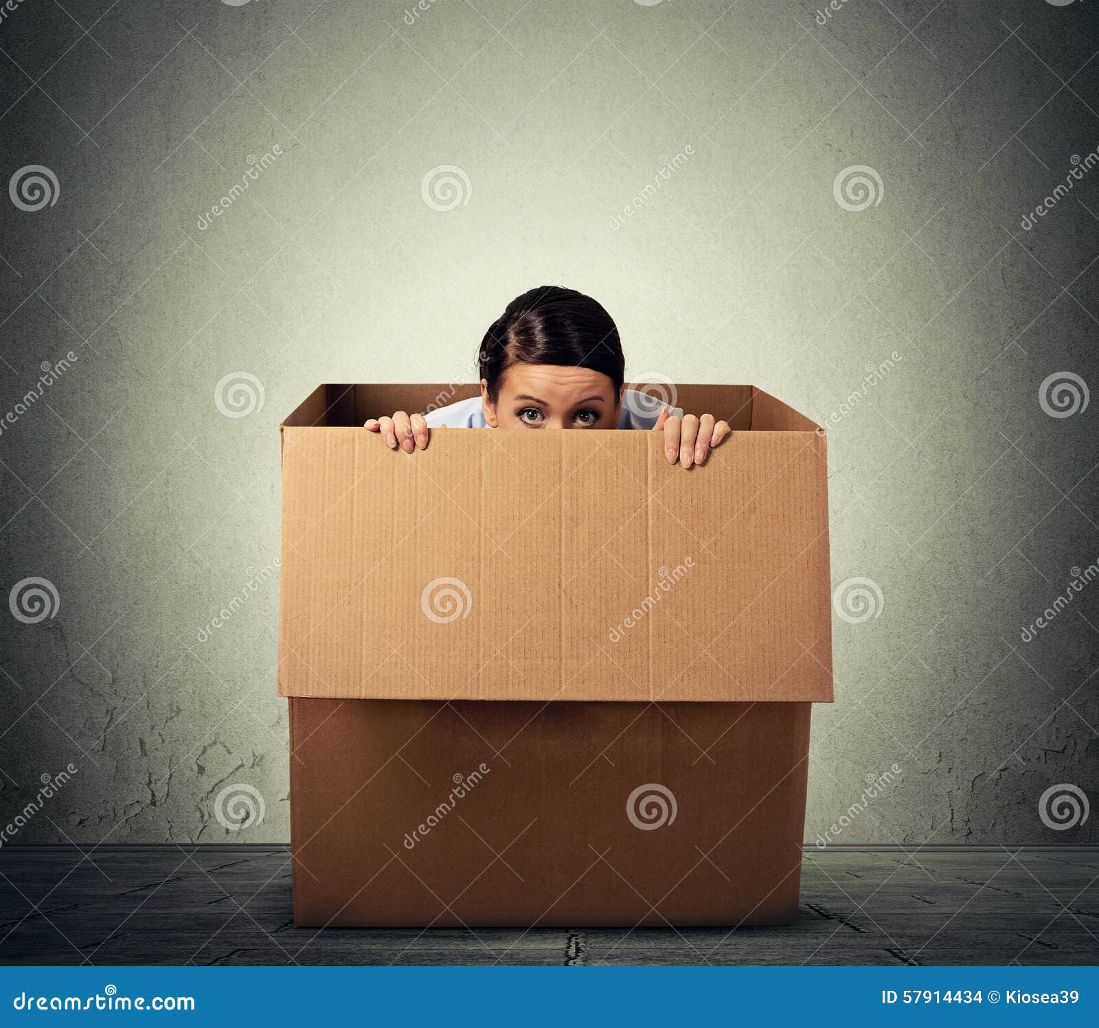 woman hiding in a carton box