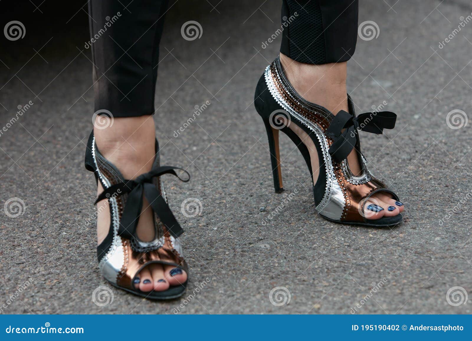 Woman with gray patent leather boots with pink heel before fashion Tod's  show, Milan Fashion Week street style on September 23 Stock Photo - Alamy