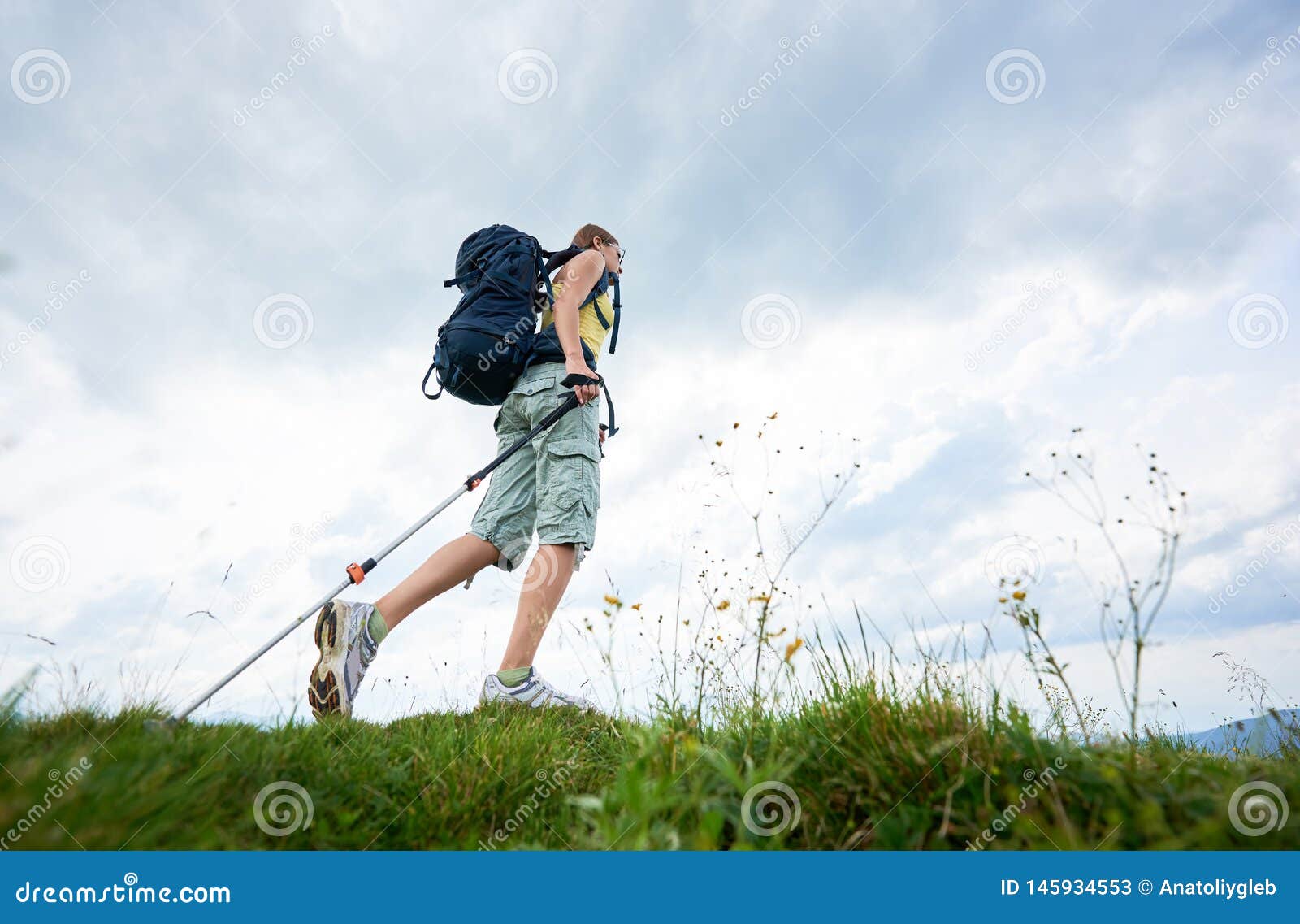 Woman Hiker Hiking On Grassy Hill, Wearing Backpack, Using 