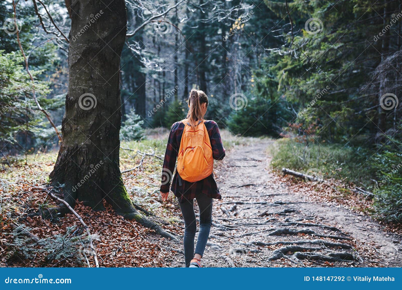 Young girl walking down trail hi-res stock photography and images