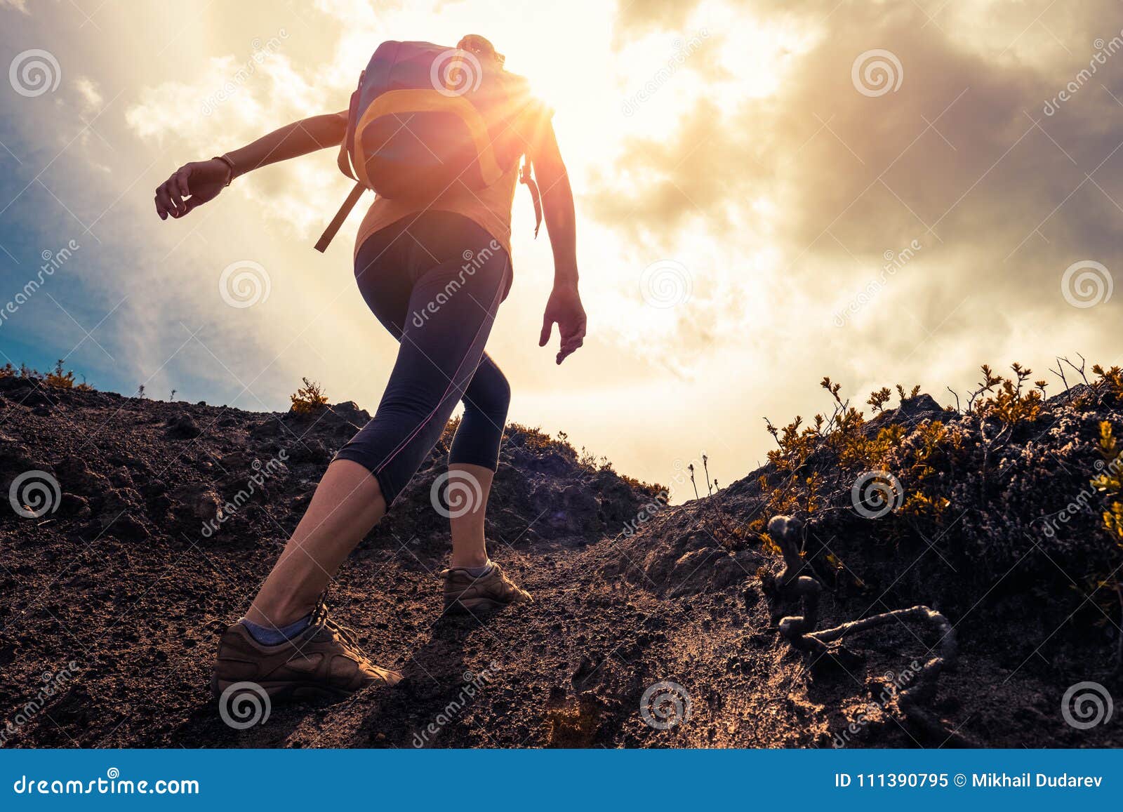 woman hiker walks on the trail