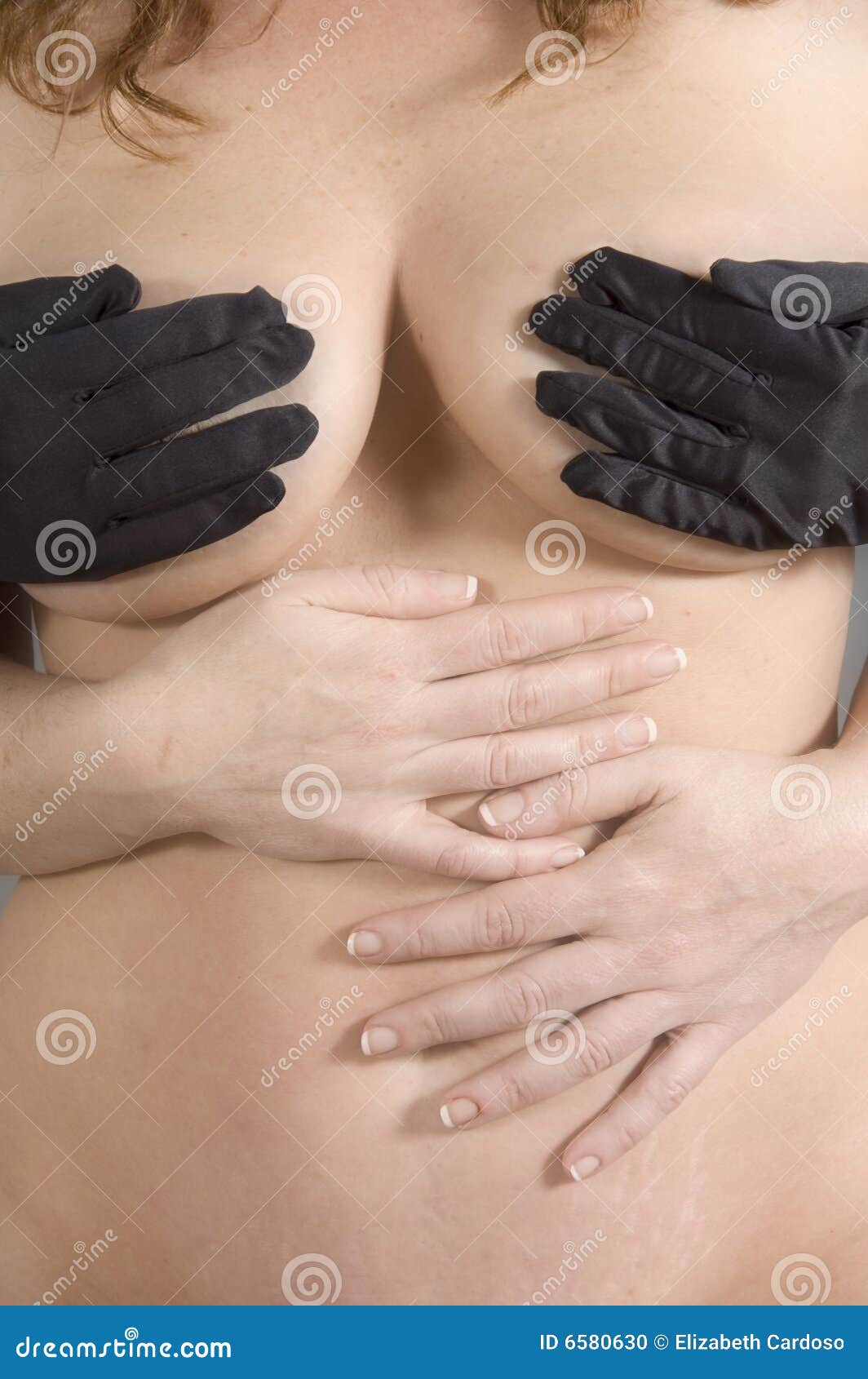 Woman's Hand Holding Breast With Drops Close Up. Photo Of A Woman In  Shadow. Stock Photo, Picture and Royalty Free Image. Image 48319372.