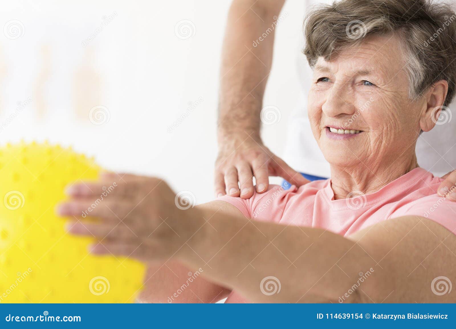 woman holding ball in physiotherapy