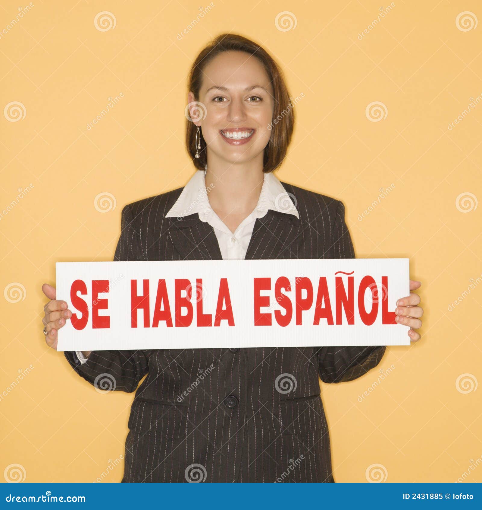 woman holding bilingual sign