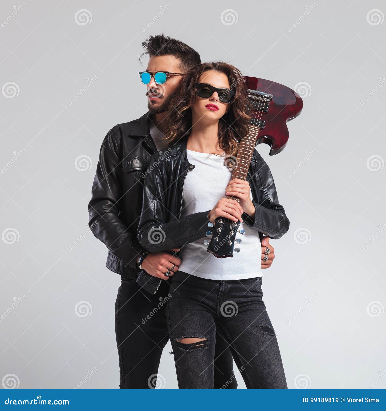 Rock and Roll Man with Guitar on Shoulder Embracing Woman Stock Image -  Image of leather, hold: 99189689