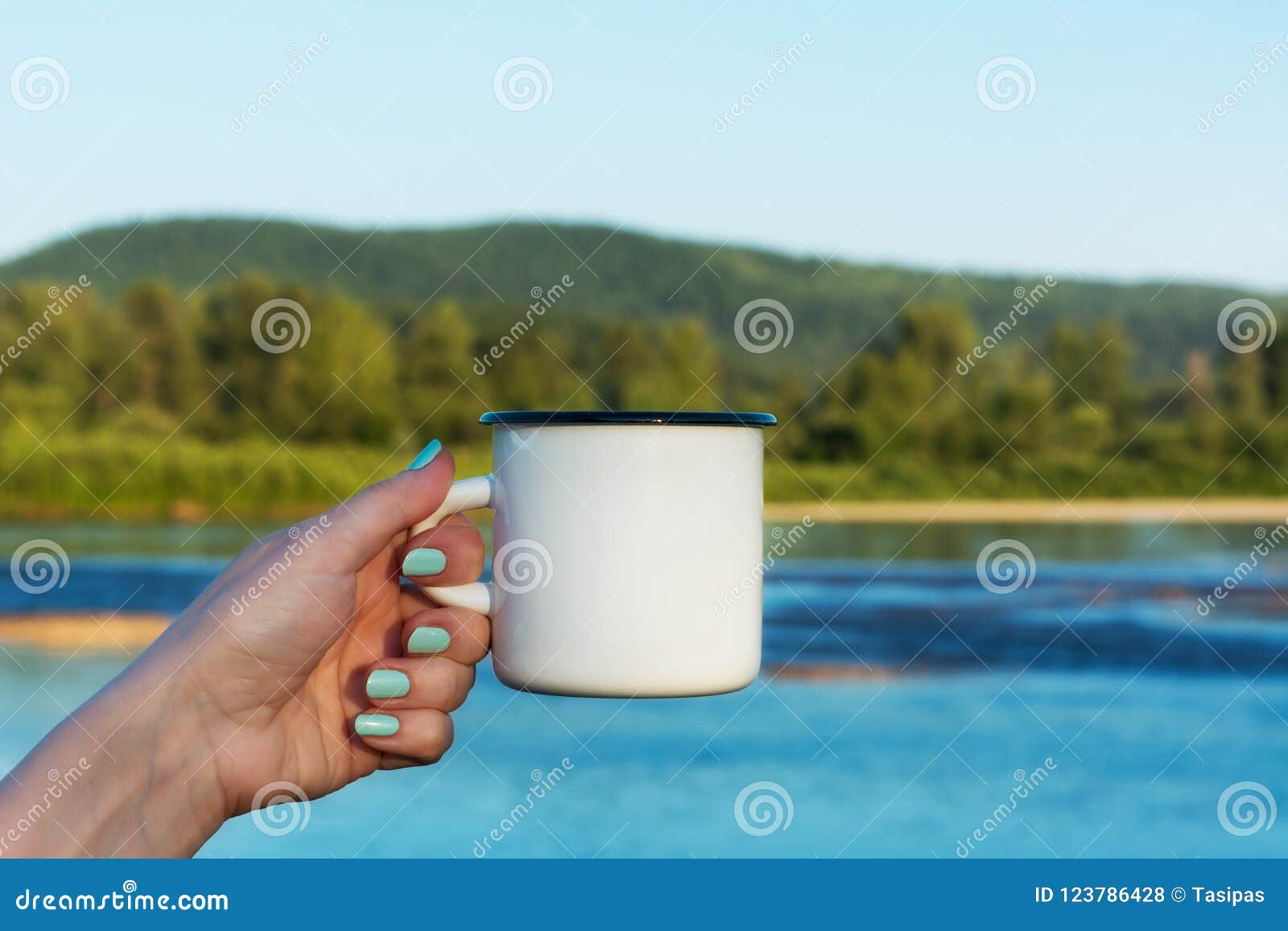 Download Woman Holding Enamel Mug With River View Stock Photo ...