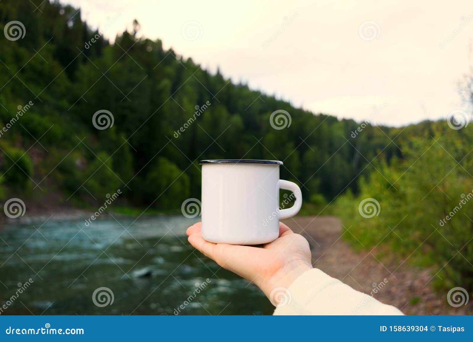 Download Woman Holding Enamel Mug With Riverside View Stock Photo ...