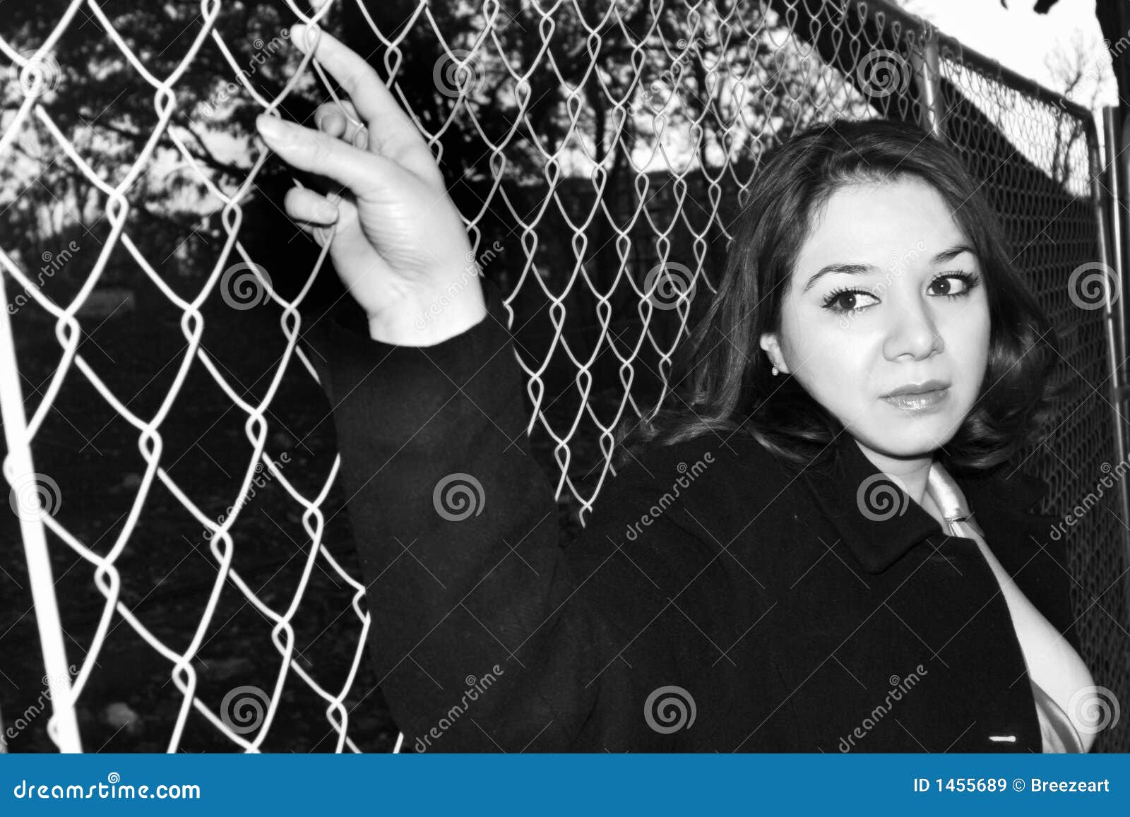 Woman holding a fence stock image. Image of beautiful 1455689