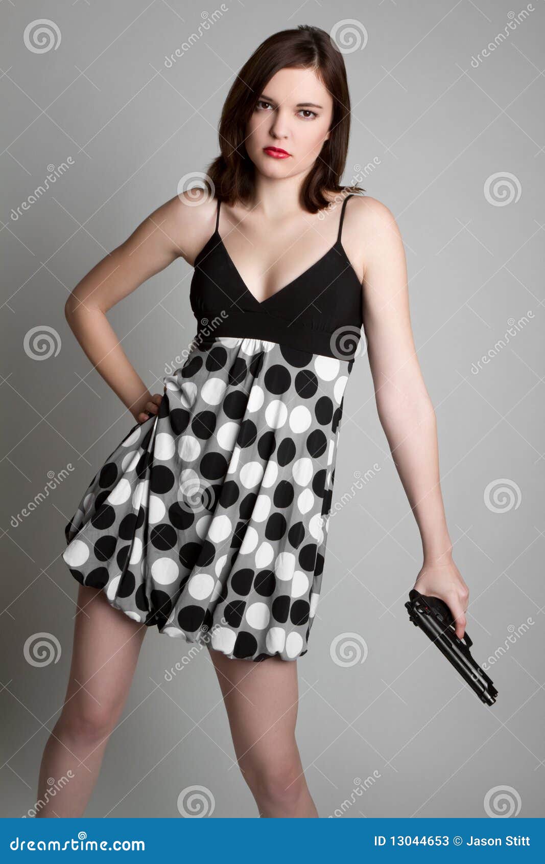 Woman Holding Gun stock image. Image of serious, beautiful 13044653