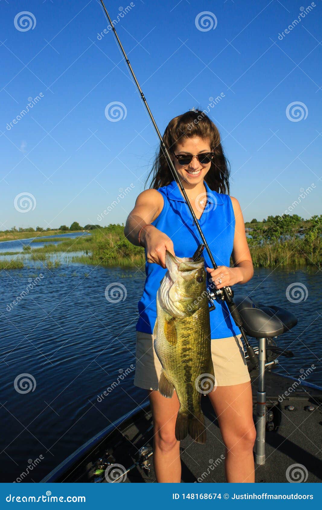 Woman Holding Large Mouth Bass Caught Fishing From Boat ...
