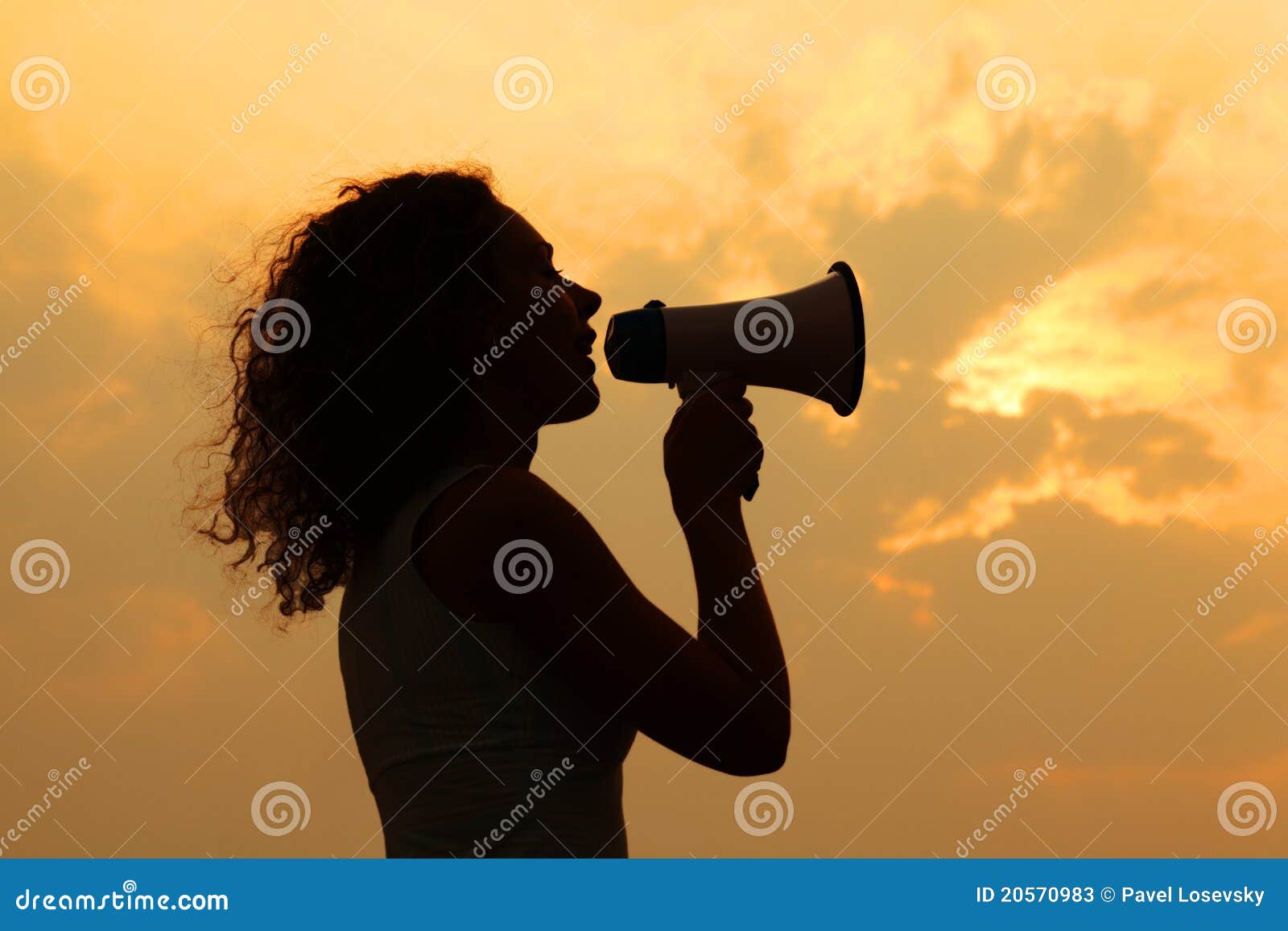 woman holding megaphone at sunset