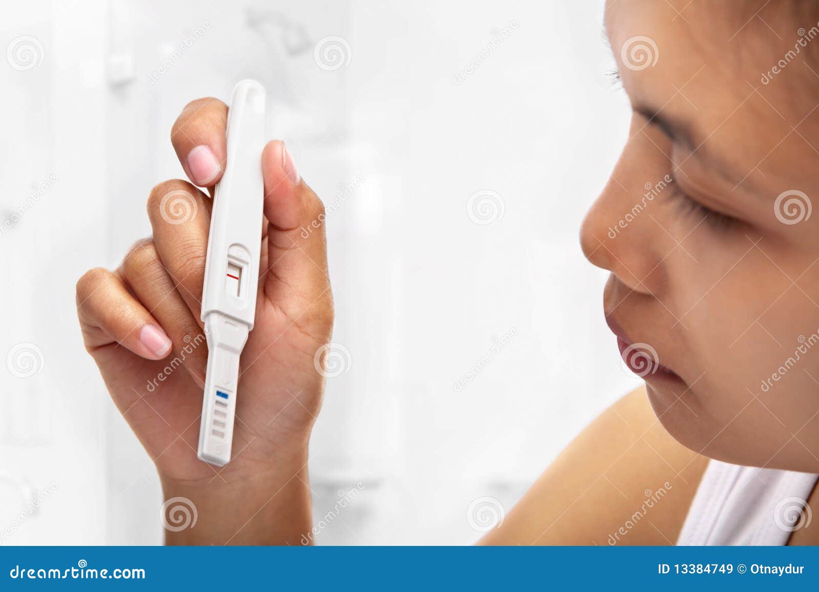 woman holding negative pregnant test result