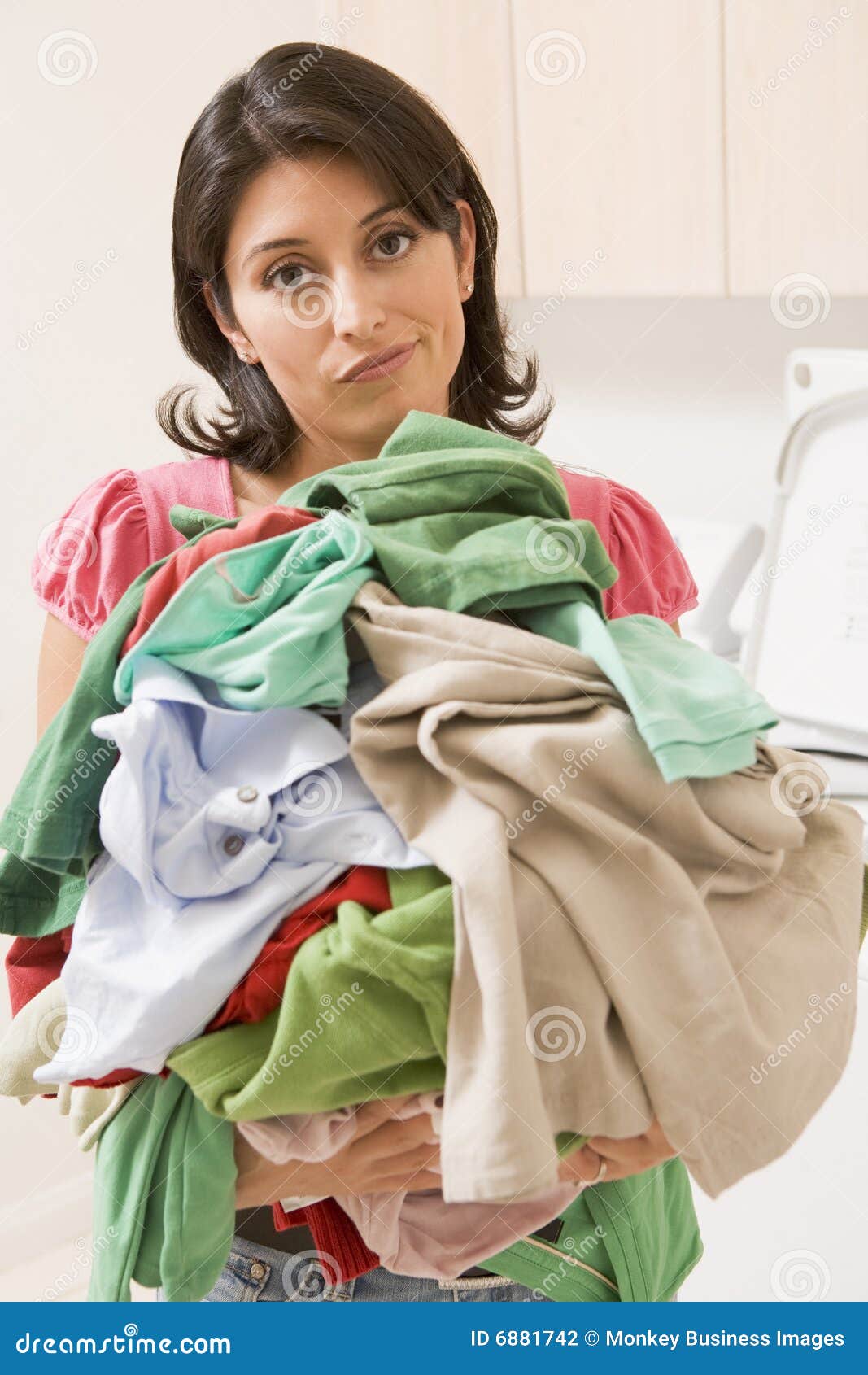 Woman Holding Pile of Laundry Stock Photo - Image of housework, routine ...