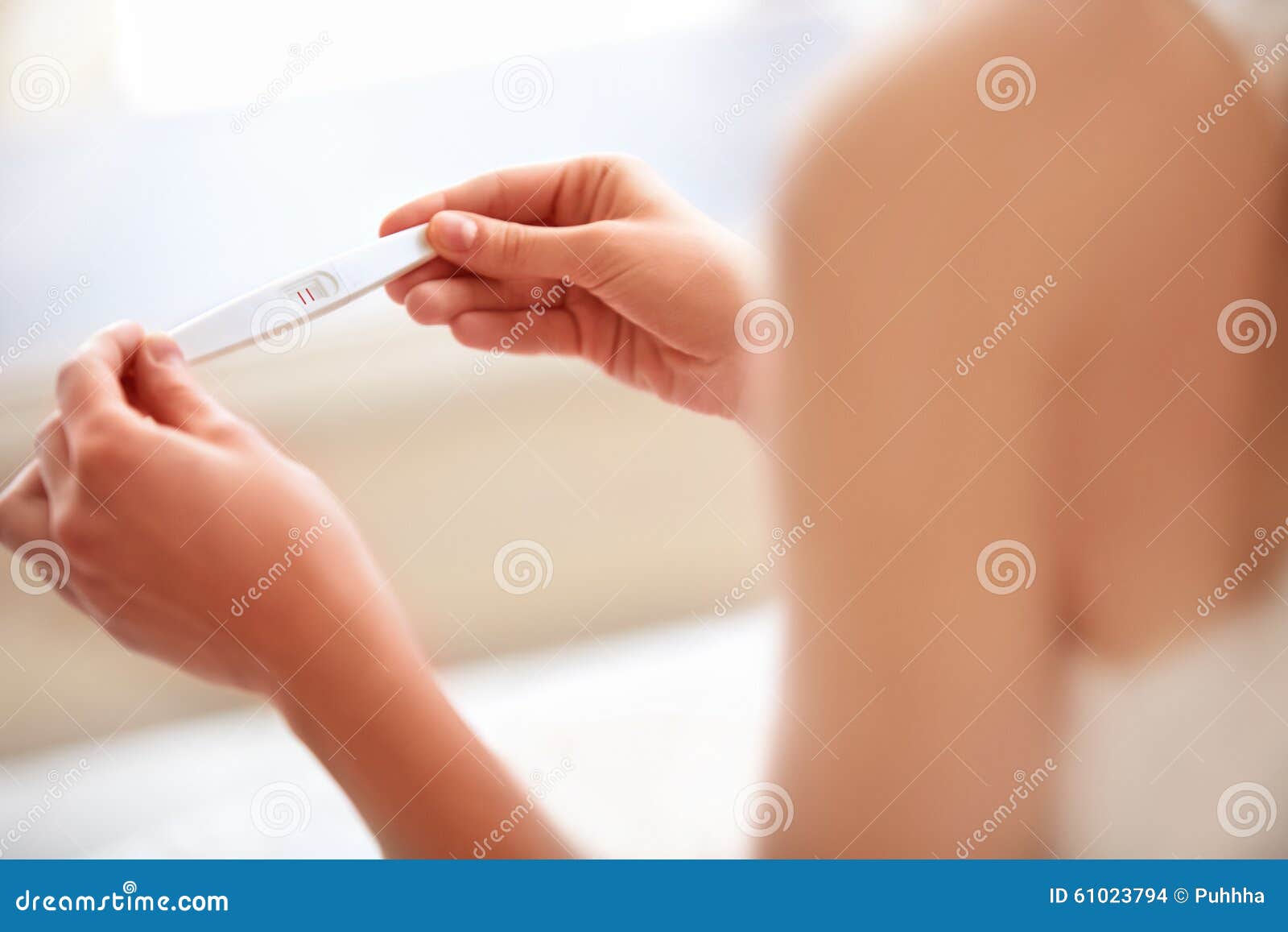 woman holding pregnancy test. pregnant