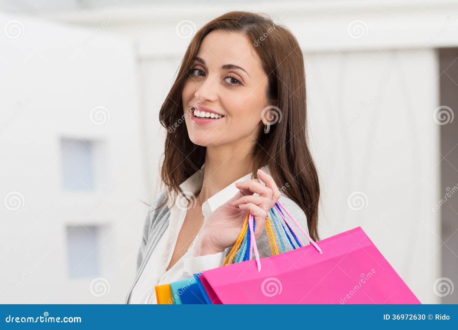 Woman Holding Shopping Bags Stock Photo - Image of lady, gift: 36972630